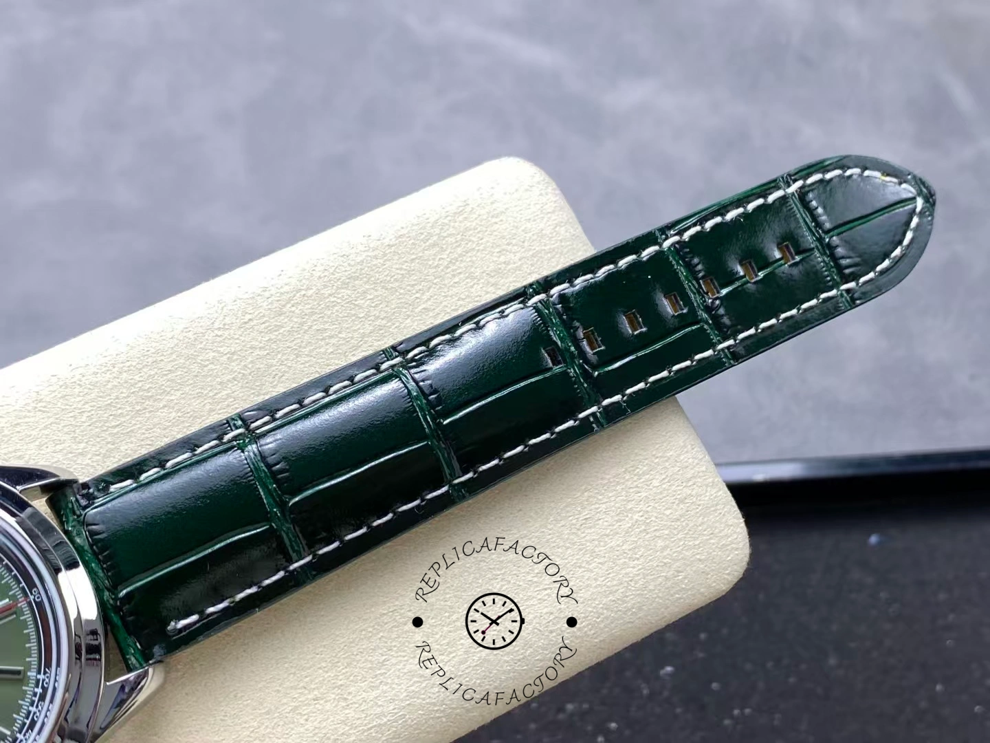 Upper strap detail of Breitling Premier B01 AB0118A11L1X1 with glossy green alligator leather.