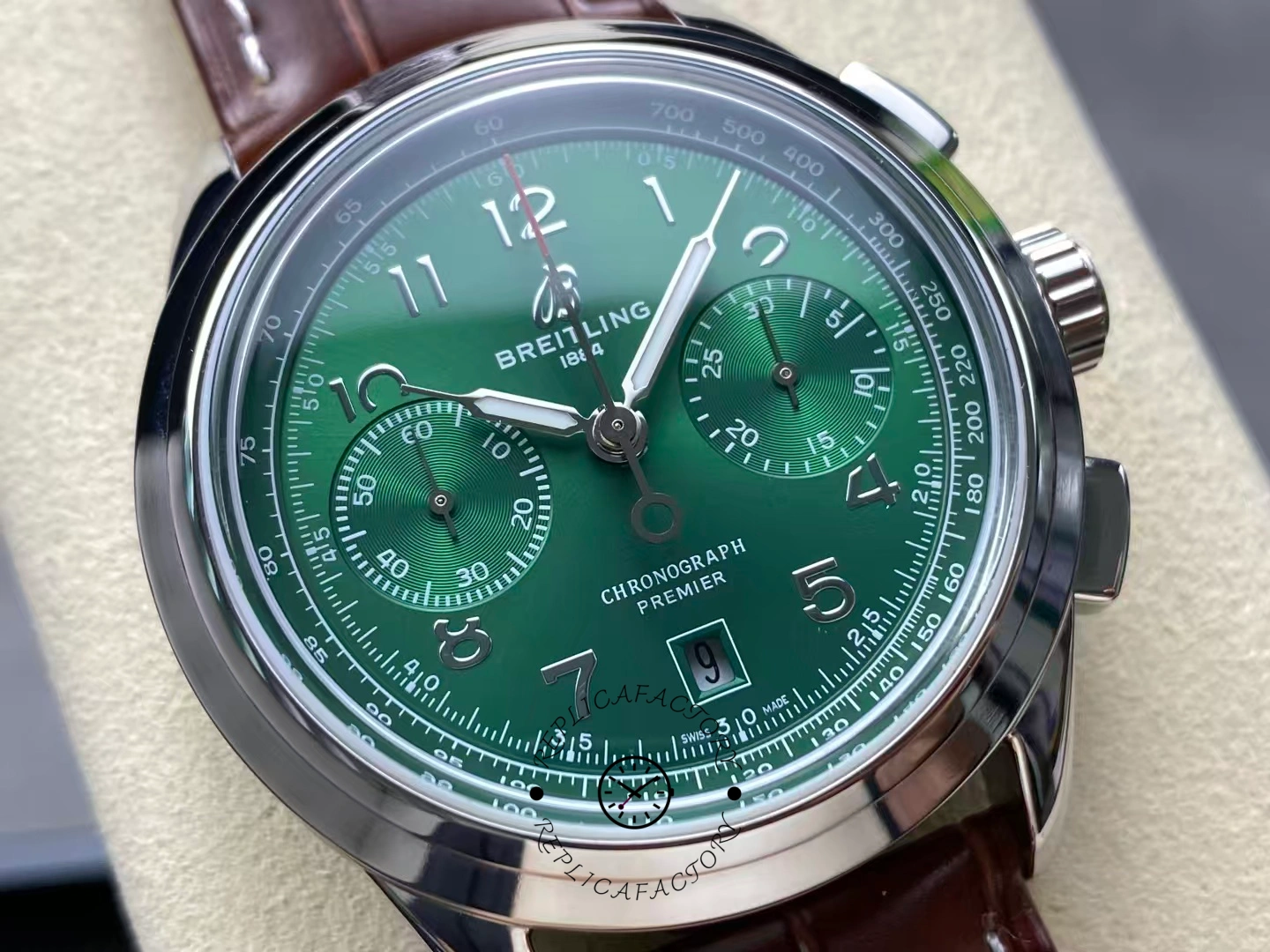 Macro view of Breitling Premier B01 AB0145371L1P1 green dial with tachymeter and subdials.