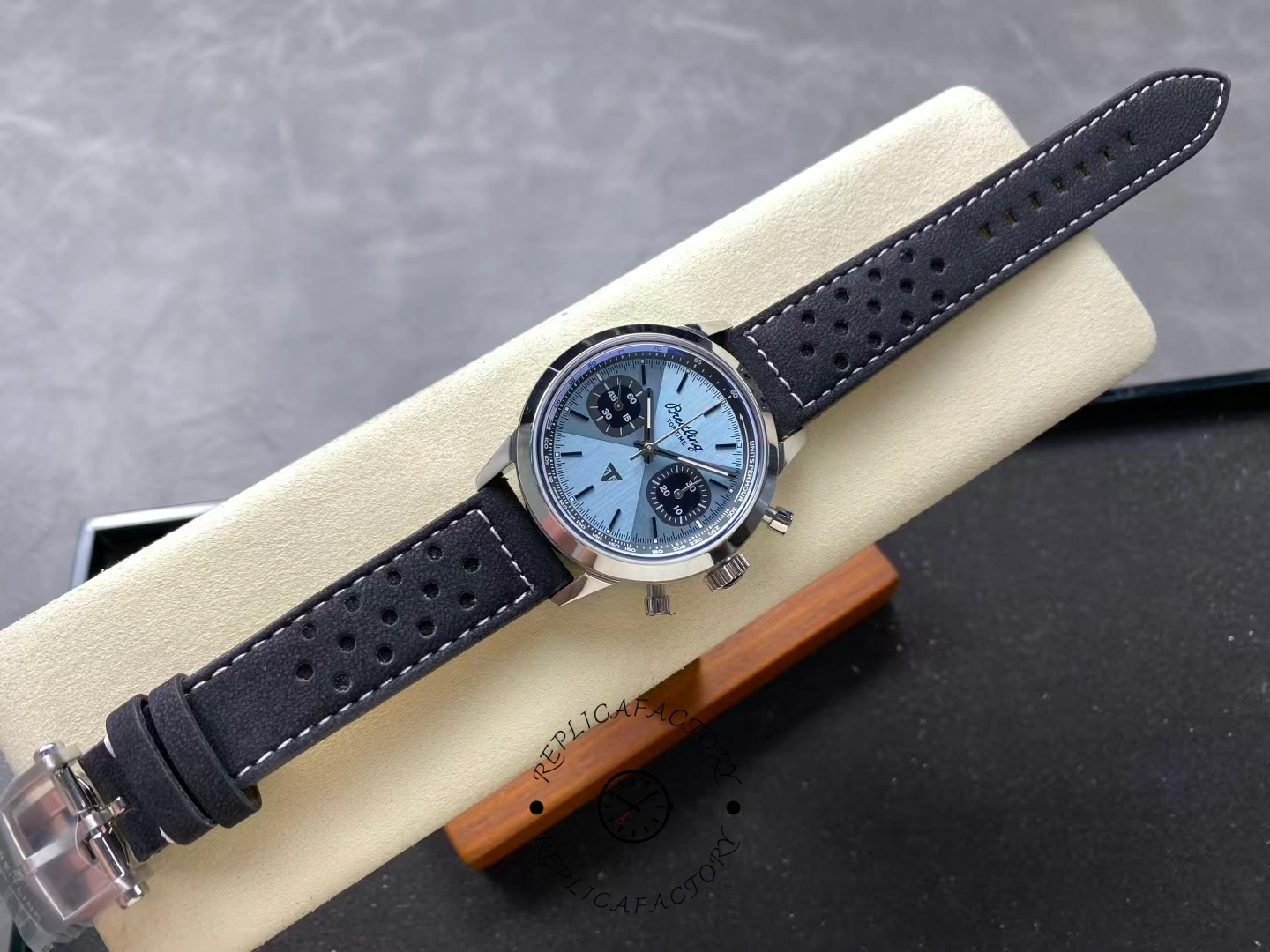 Full view of Breitling Top Time Triumph A23311121C1X1 with ice-blue dial and black strap.