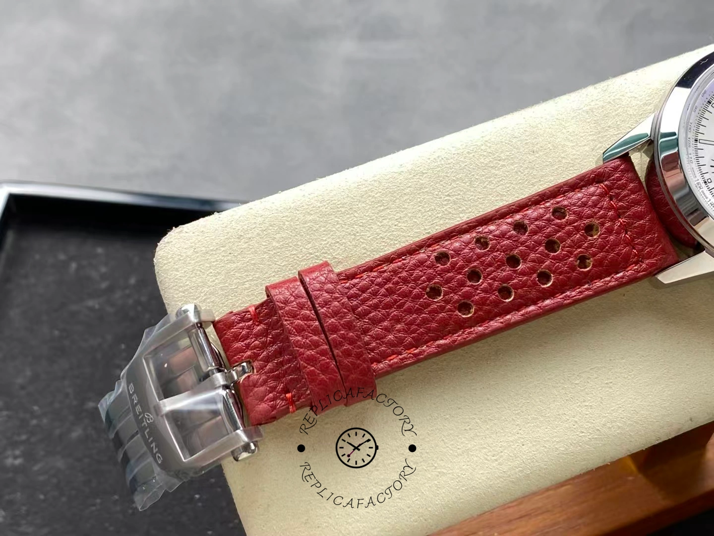 Buckle detail of Breitling Premier B01 AB0176A71A1X1 with engraved Breitling logo clasp.