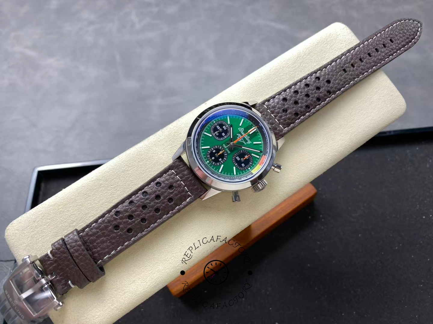 Full view of Breitling Top Time B01 AB01762A1L1X1 green dial watch with brown strap.