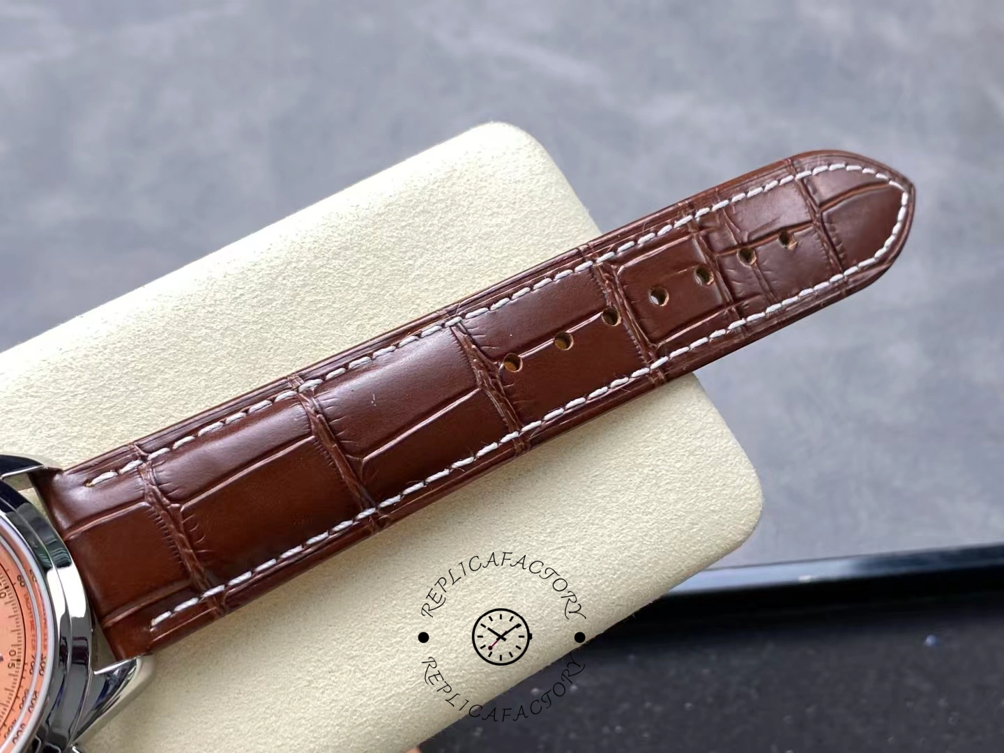 Upper leather strap detail of Breitling Premier B01 AB0145331K1P2 showing stitching texture.