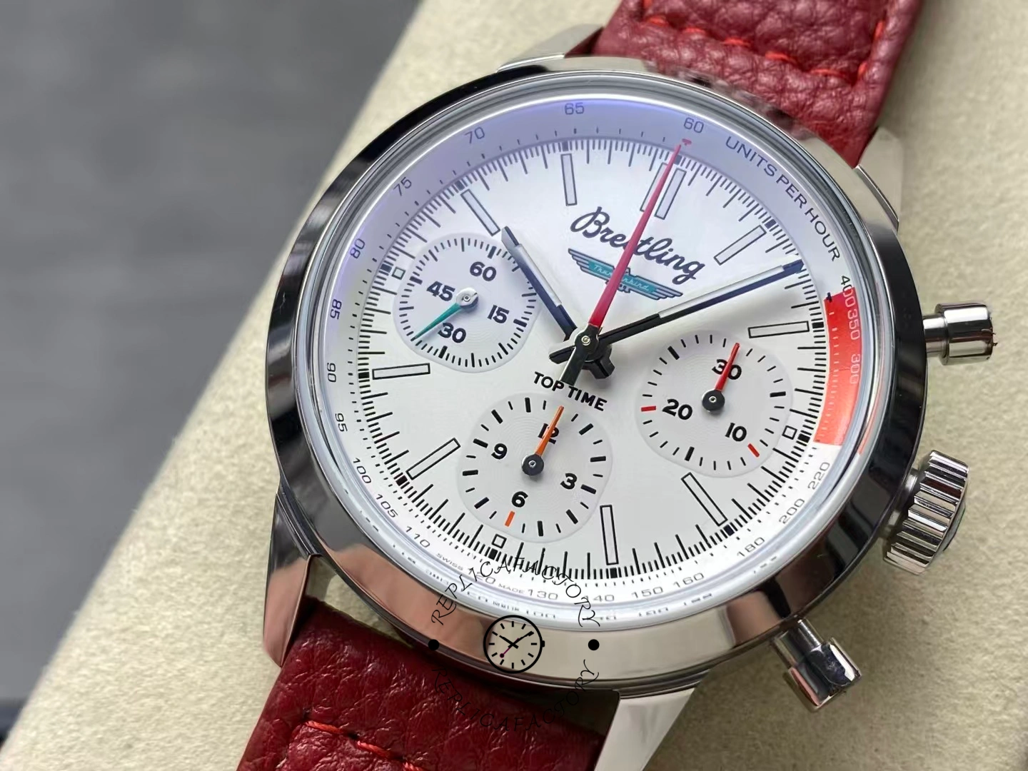 Close-up of Breitling Premier B01 AB0176A71A1X1 white dial with red leather strap.