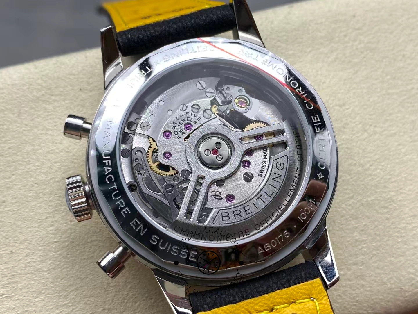 Exhibition caseback of Breitling Top Time B01 Triumph AB017641C1X1 showing movement details.