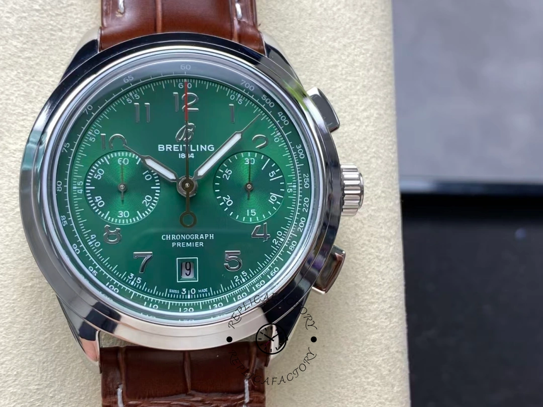 Front view of Breitling Premier B01 AB0145371L1P1 showing dual subdials and green dial design. - Front view