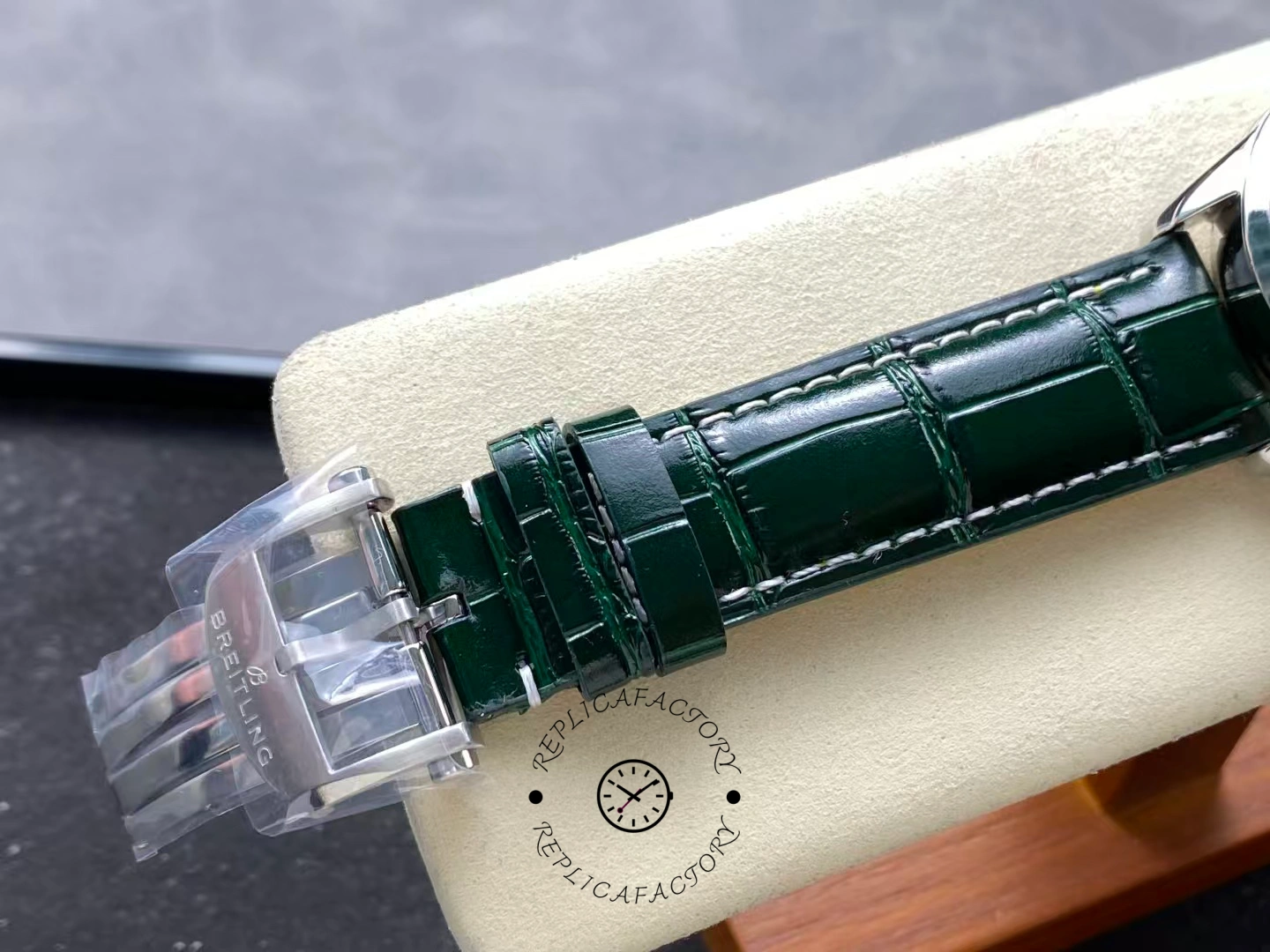Buckle detail of Breitling Premier B01 Chronograph 42 AB0118A11L1X1 with green leather strap.
