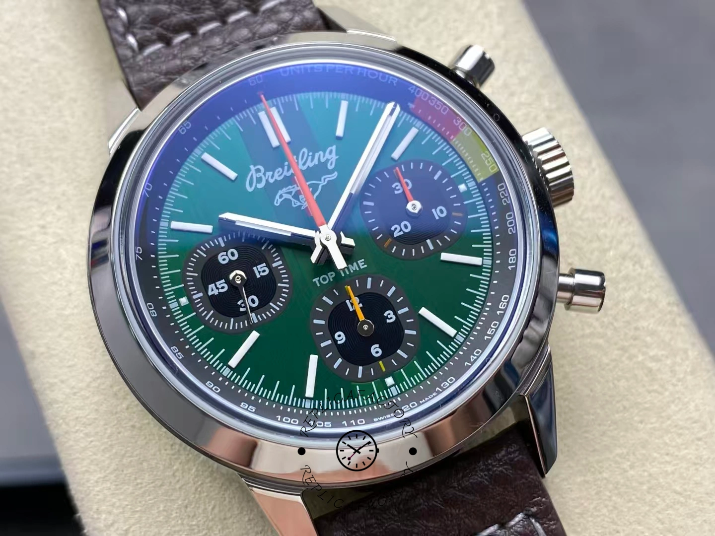 Centered view of Breitling Top Time B01 AB01762A1L1X1 green dial and chronograph hands.