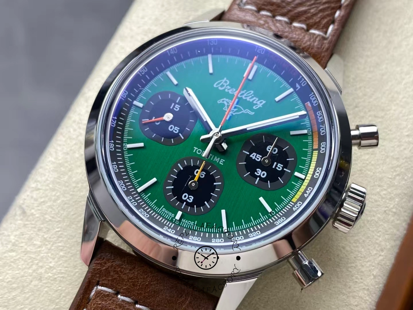 Close-up of Breitling Top Time Ford Mustang A253101A1L1X1 green dial with brown strap.