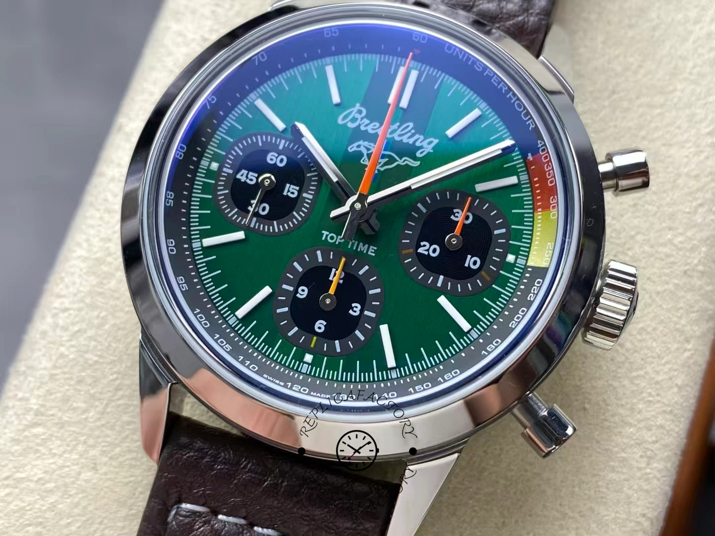 Close-up of Breitling Top Time B01 AB01762A1L1X1 green dial with brown leather strap.