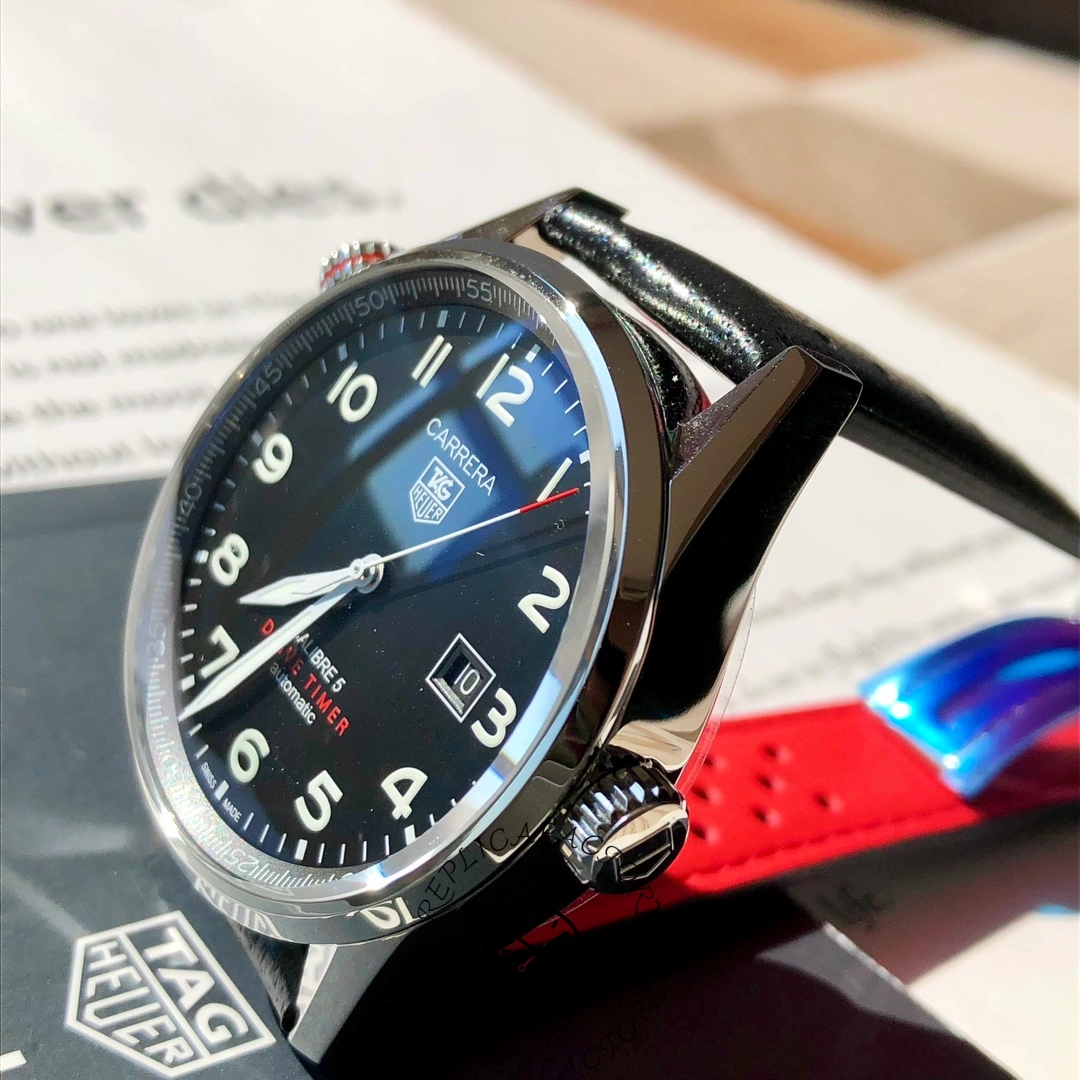 Side angle of TAG Heuer Carrera Calibre 5 WAR2A10.FC6337 with crown and red strap underside.