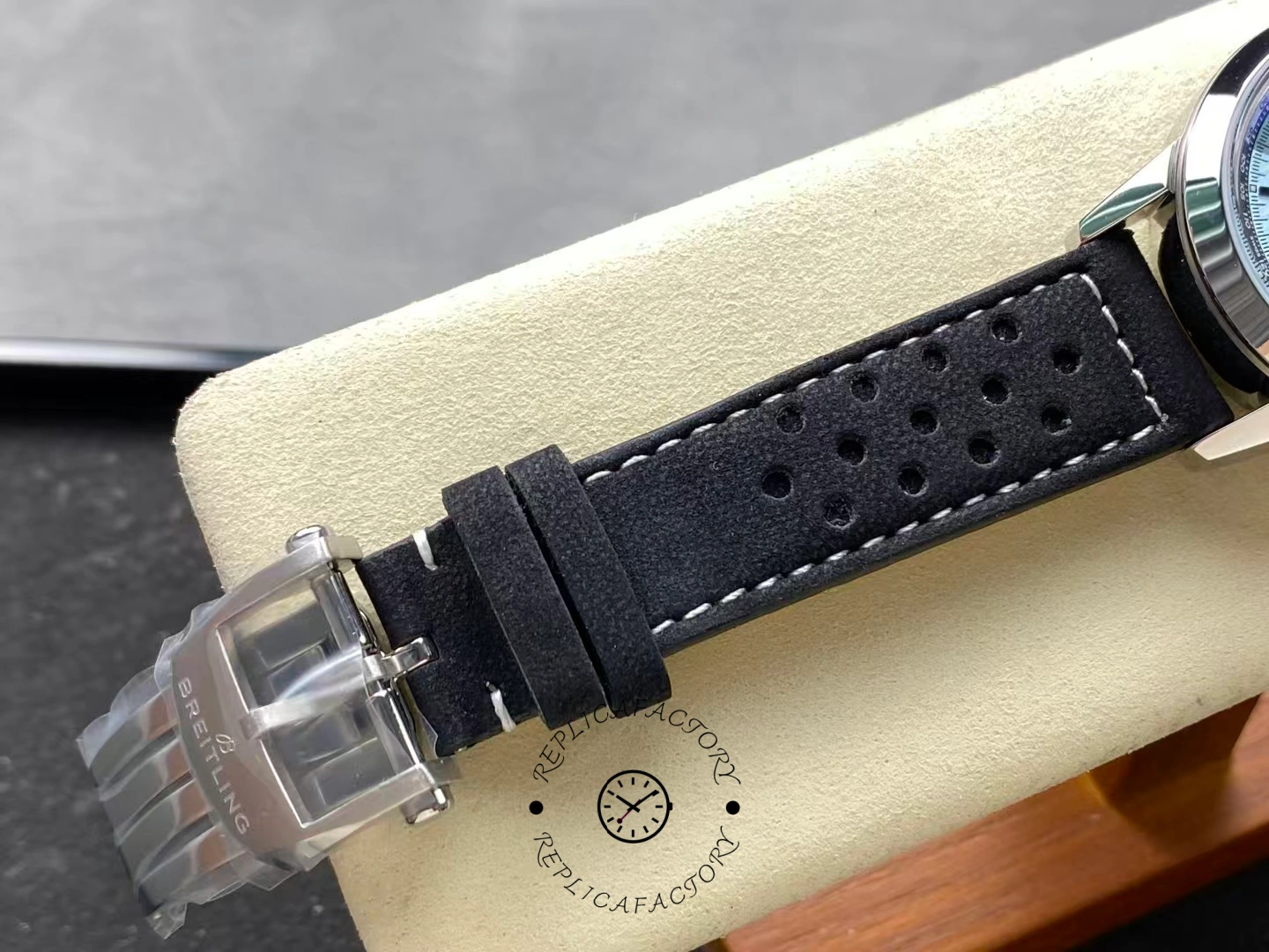 Buckle detail of Breitling Top Time Triumph A23311121C1X1 with logo clasp.