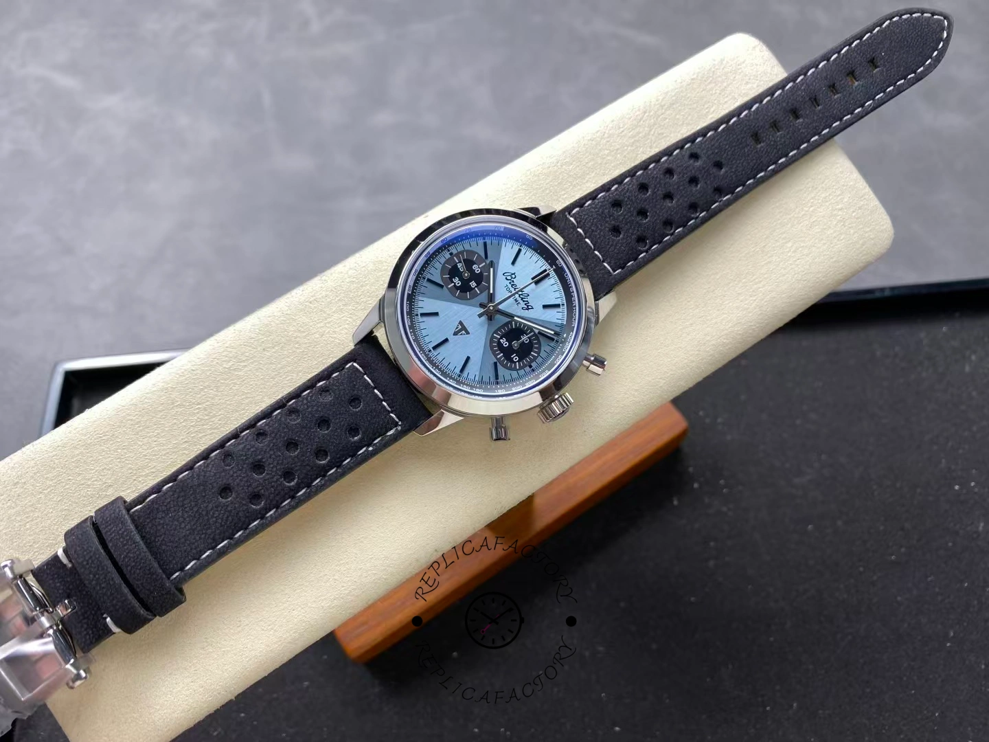 Full view of Breitling Top Time B01 Triumph AB017641C1X1 ice blue dial with black strap.