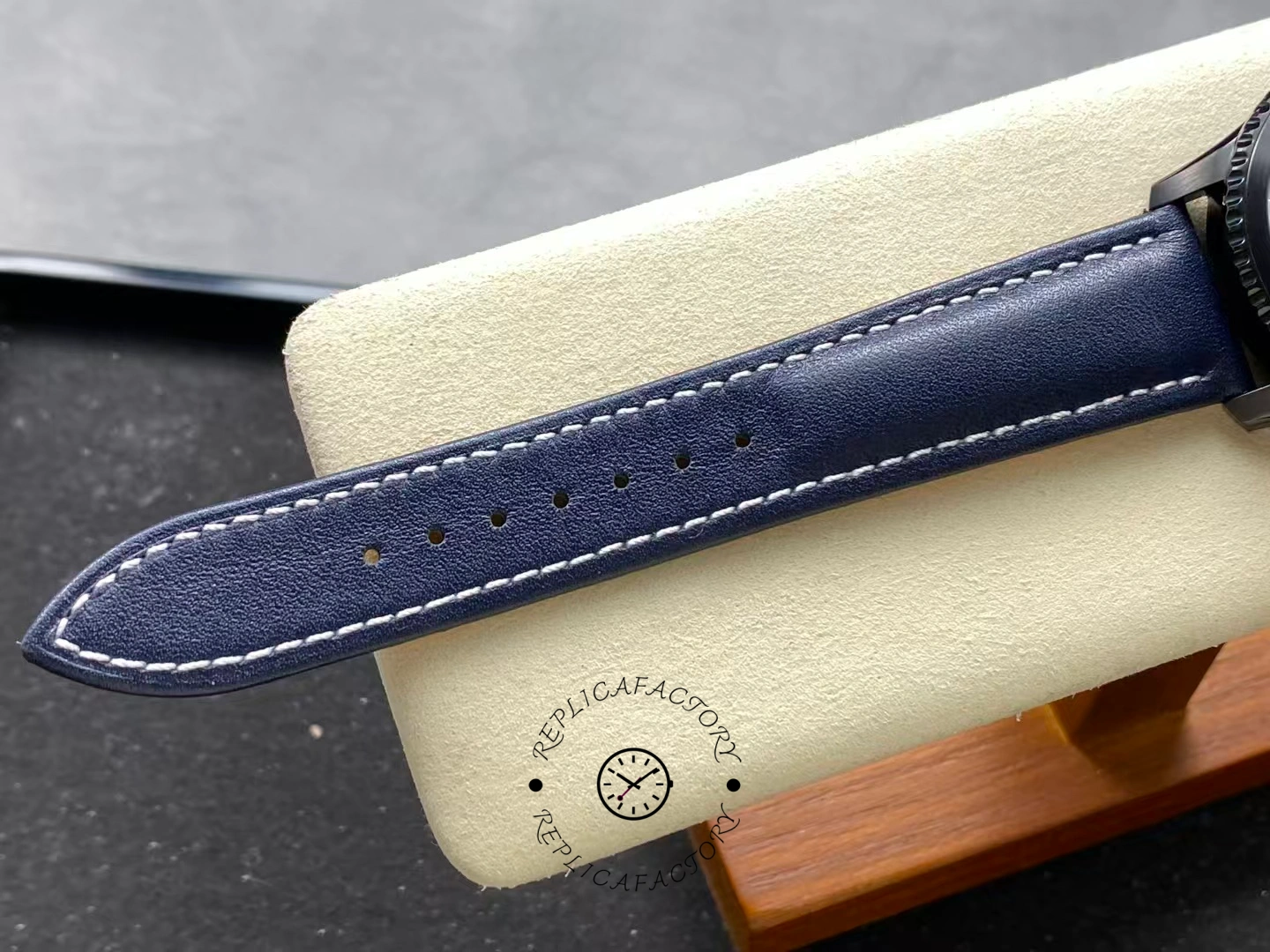 View of Breitling Navitimer Aviator 8 M17314101B1X1 showing blue leather strap stitching details.