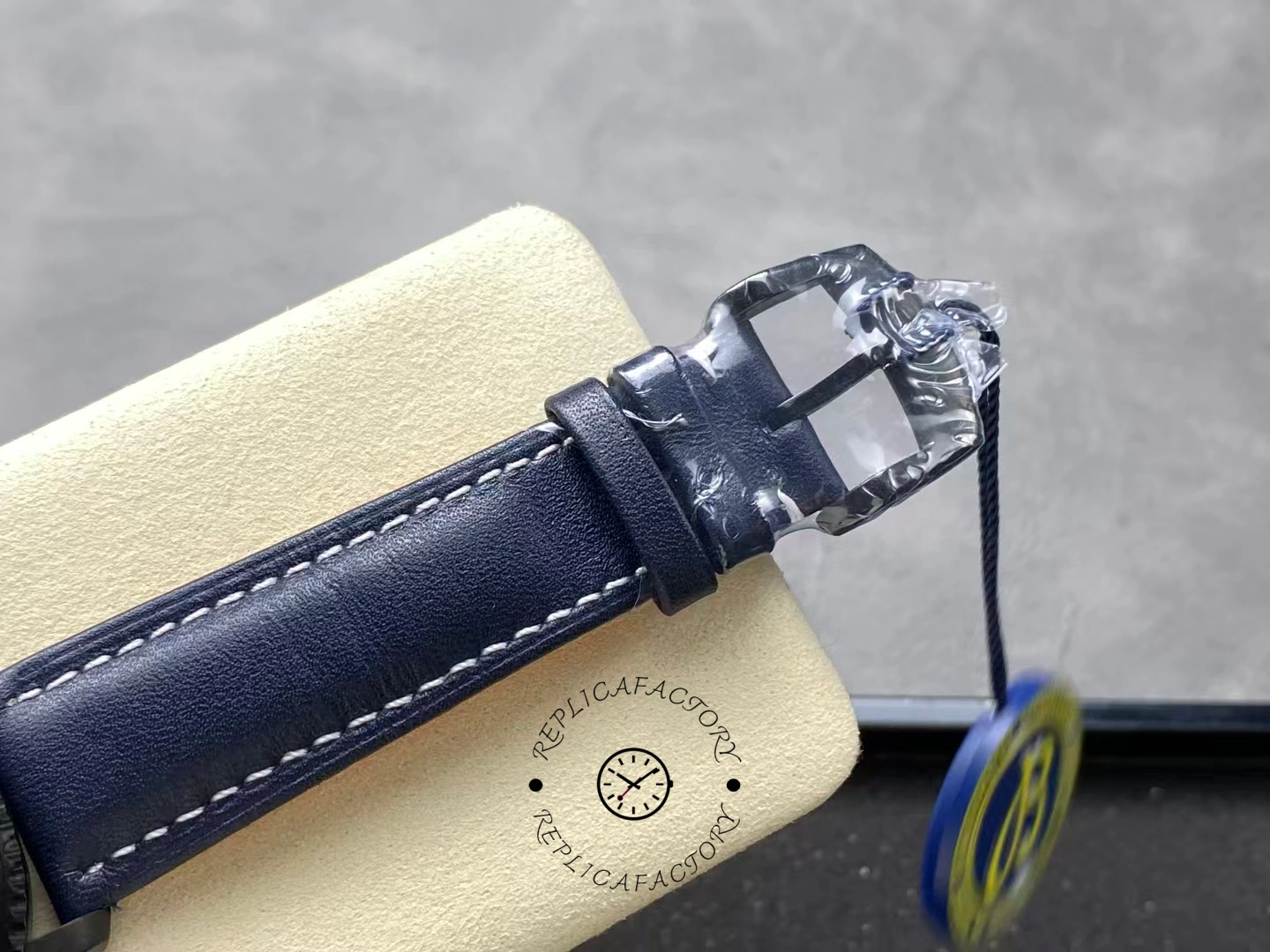 Buckle close-up of Breitling Navitimer Aviator 8 M17314101B1X1 black clasp on blue strap.