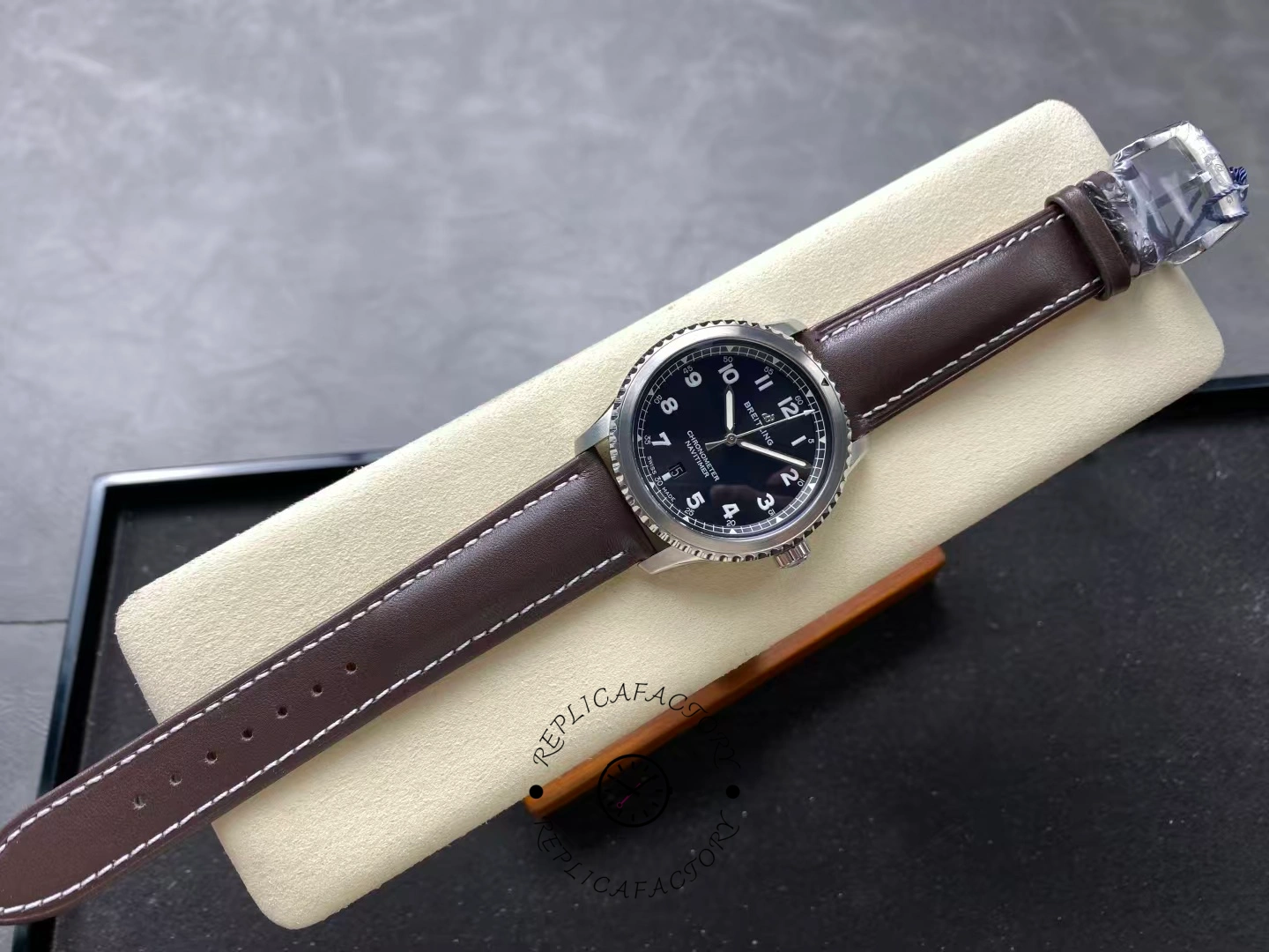 Full top-down view of Breitling Navitimer 8 Automatic 41 A17314101B1X1 on display cushion.