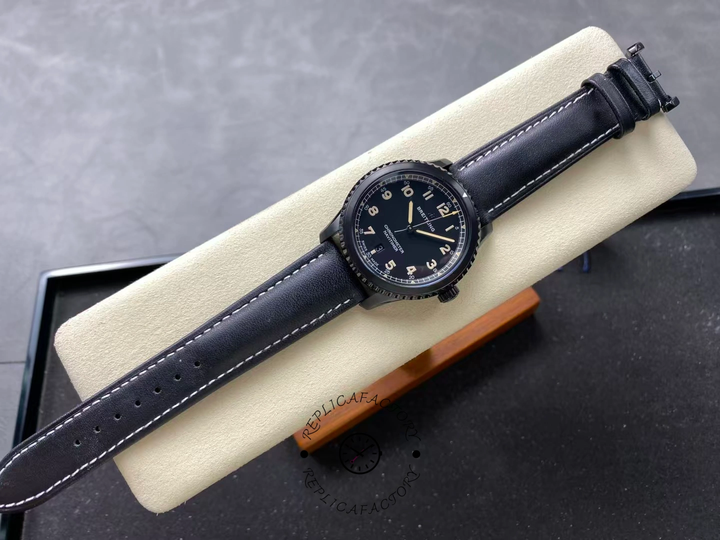 Full top-down view of Breitling Navitimer 8 Automatic 41 M17314101B1X1 on display cushion.