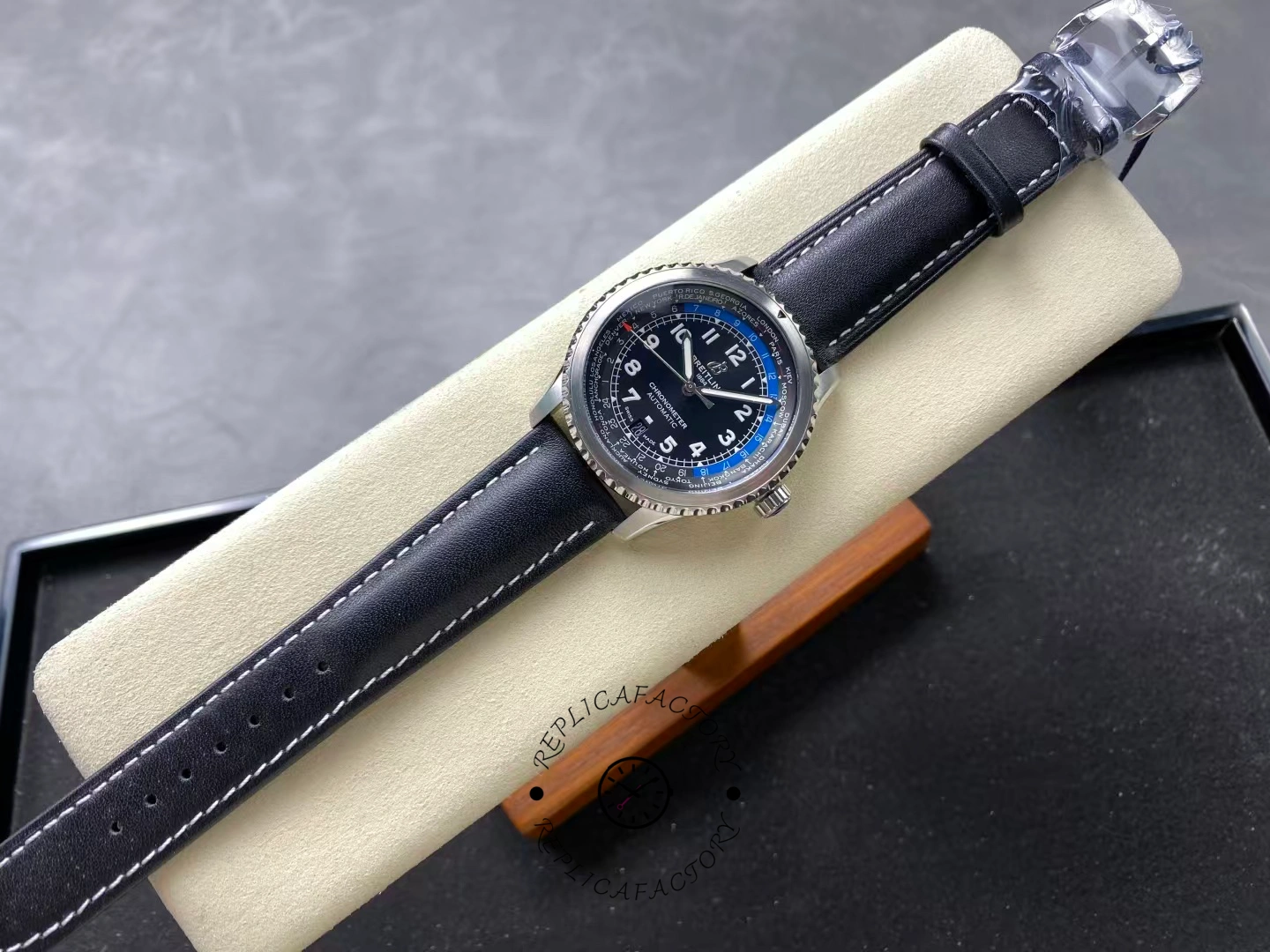 Full top-down view of Breitling Aviator 8 B35 Unitime 43 AB3521U41B1P1 on display cushion.