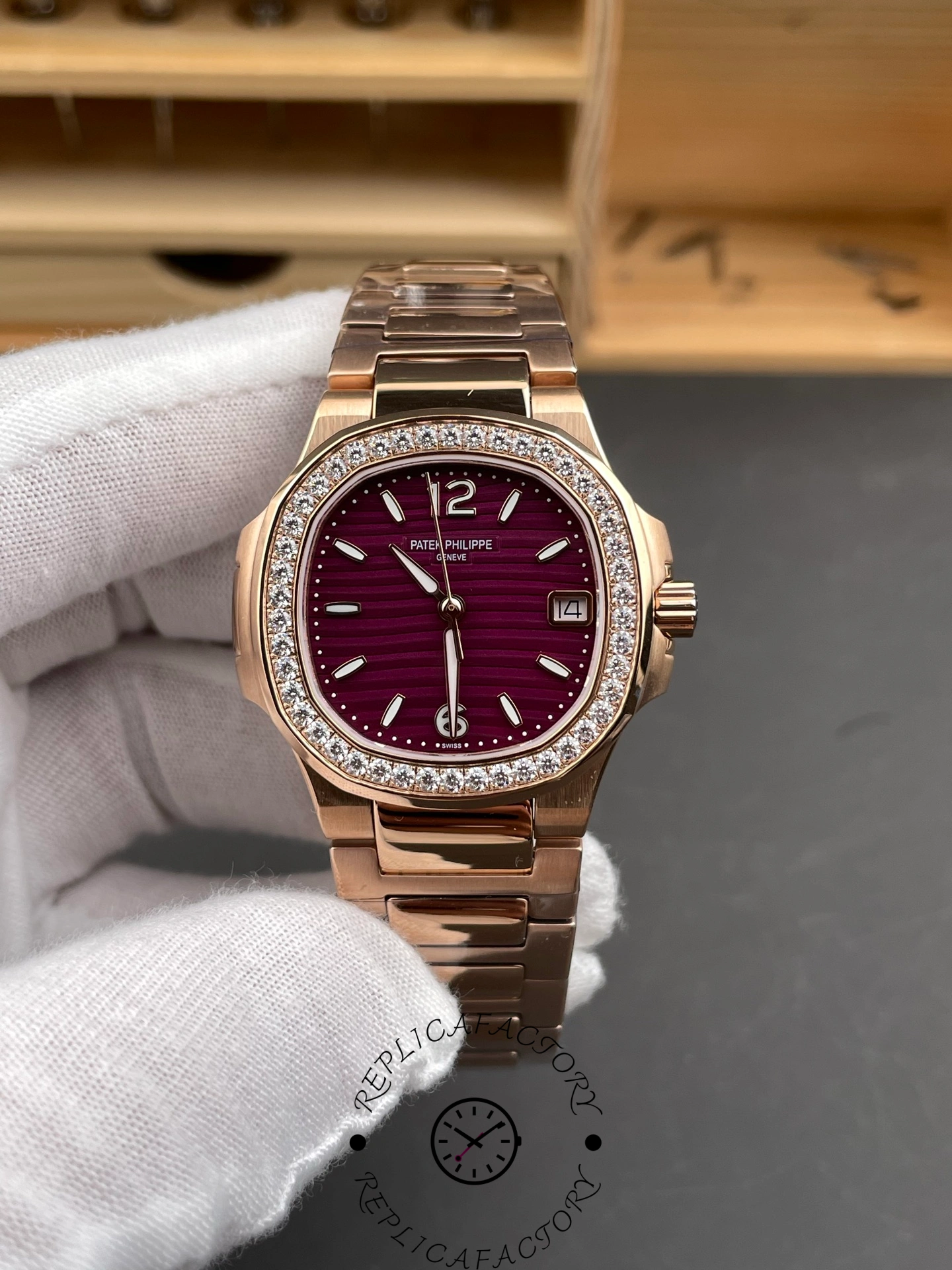 Front view of Patek Philippe Nautilus 7010/1R-013 showing purple dial and diamond bezel.