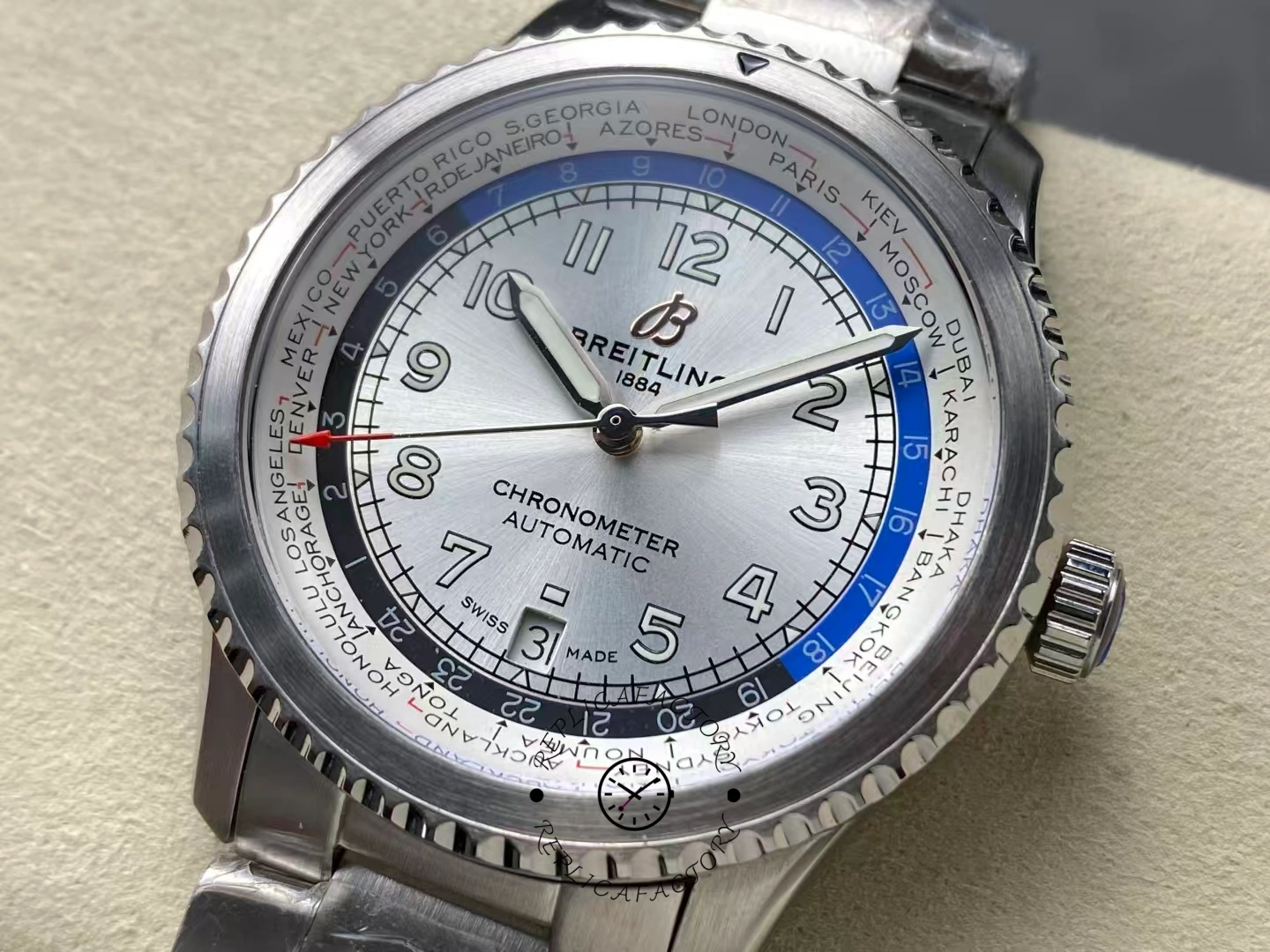 Close-up of Breitling Aviator 8 B35 AB3521U01G1A1 showing silver world time dial with blue 24-hour ring.