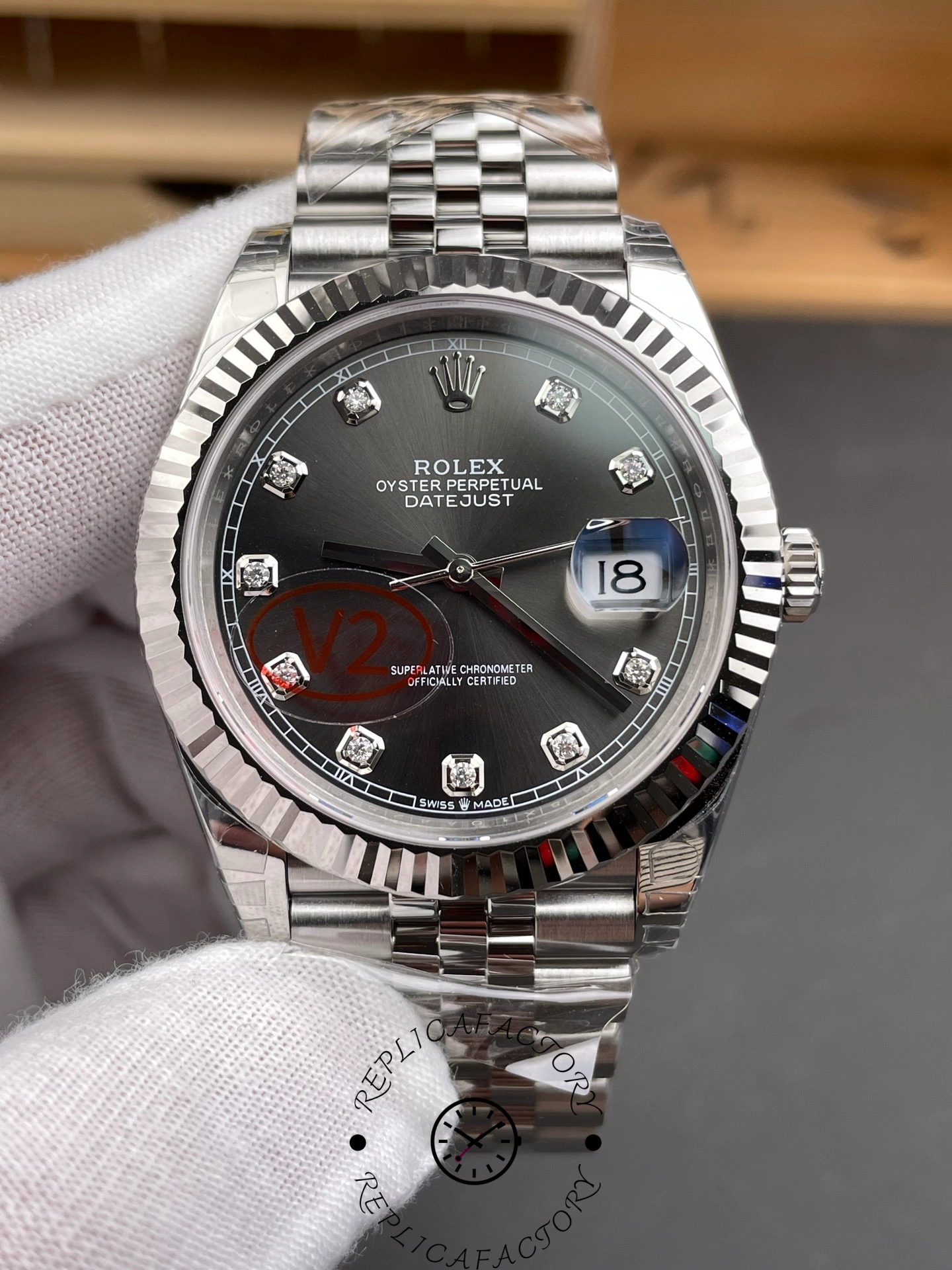 Close-up of Rolex Datejust 41mm m126334-0012 dial showing diamond markers and fluted bezel.