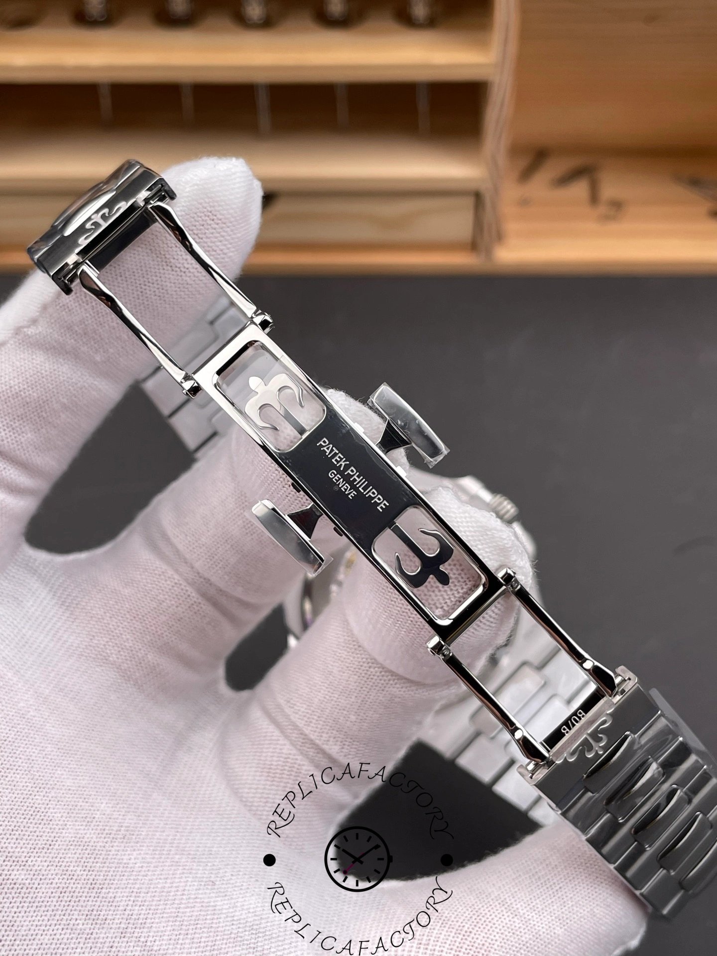 Folding clasp interior of Patek Philippe Nautilus 5811/1G-001 showing logo engraving.