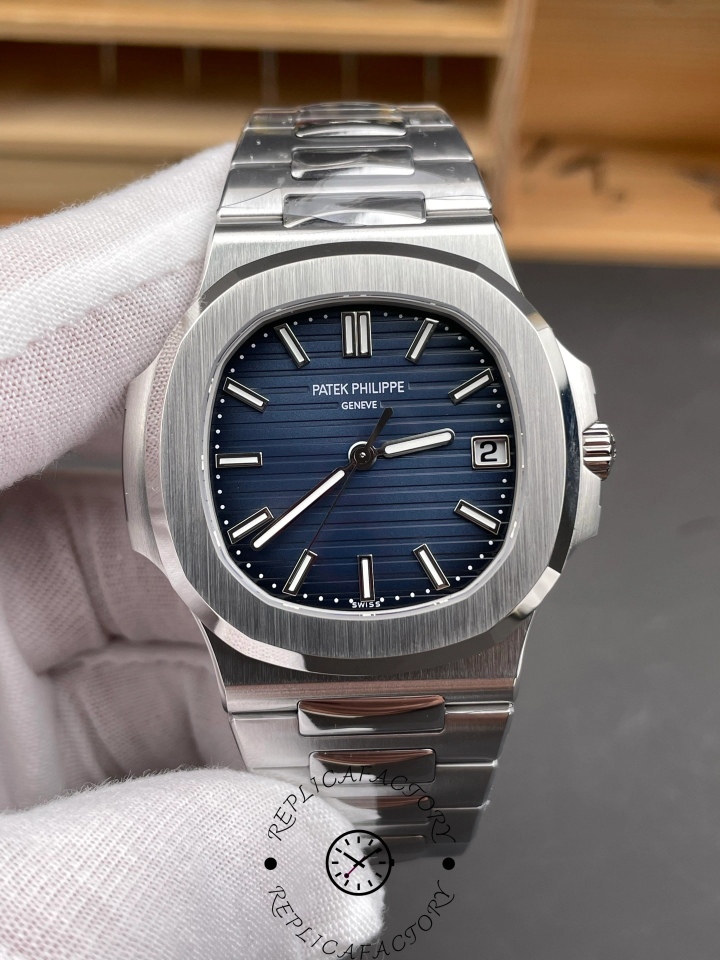 Close-up of Patek Philippe Nautilus 5811/1G-001 dial with horizontal line pattern.