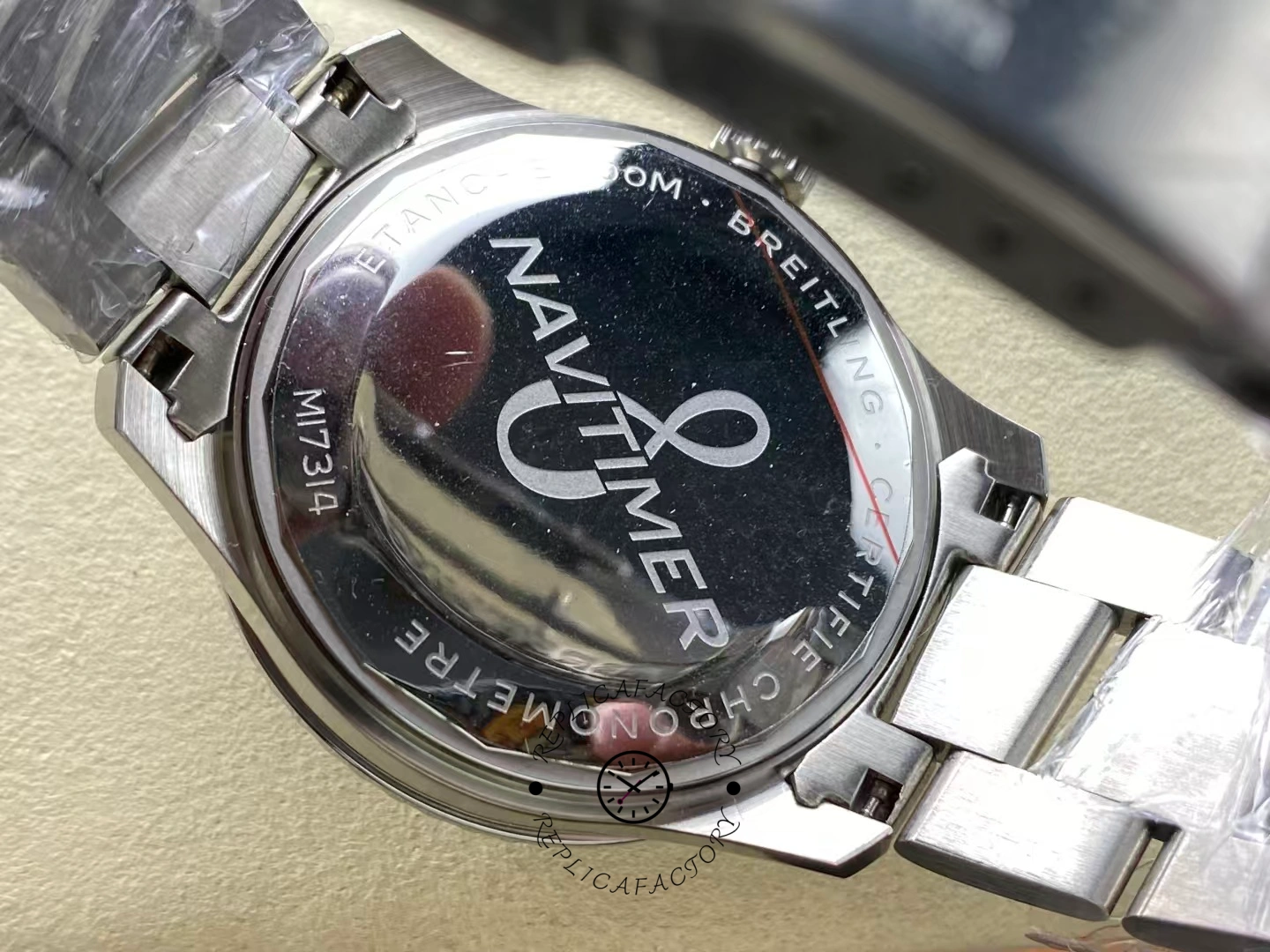 Caseback of Breitling Aviator 8 A17315101B1A1 engraved with Navitimer certification.