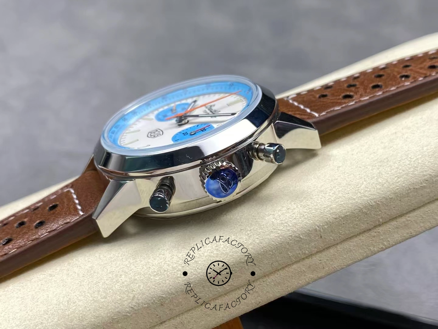 Crown side of Breitling Top Time Deus A233112A1A1X1 showing pushers and crown.