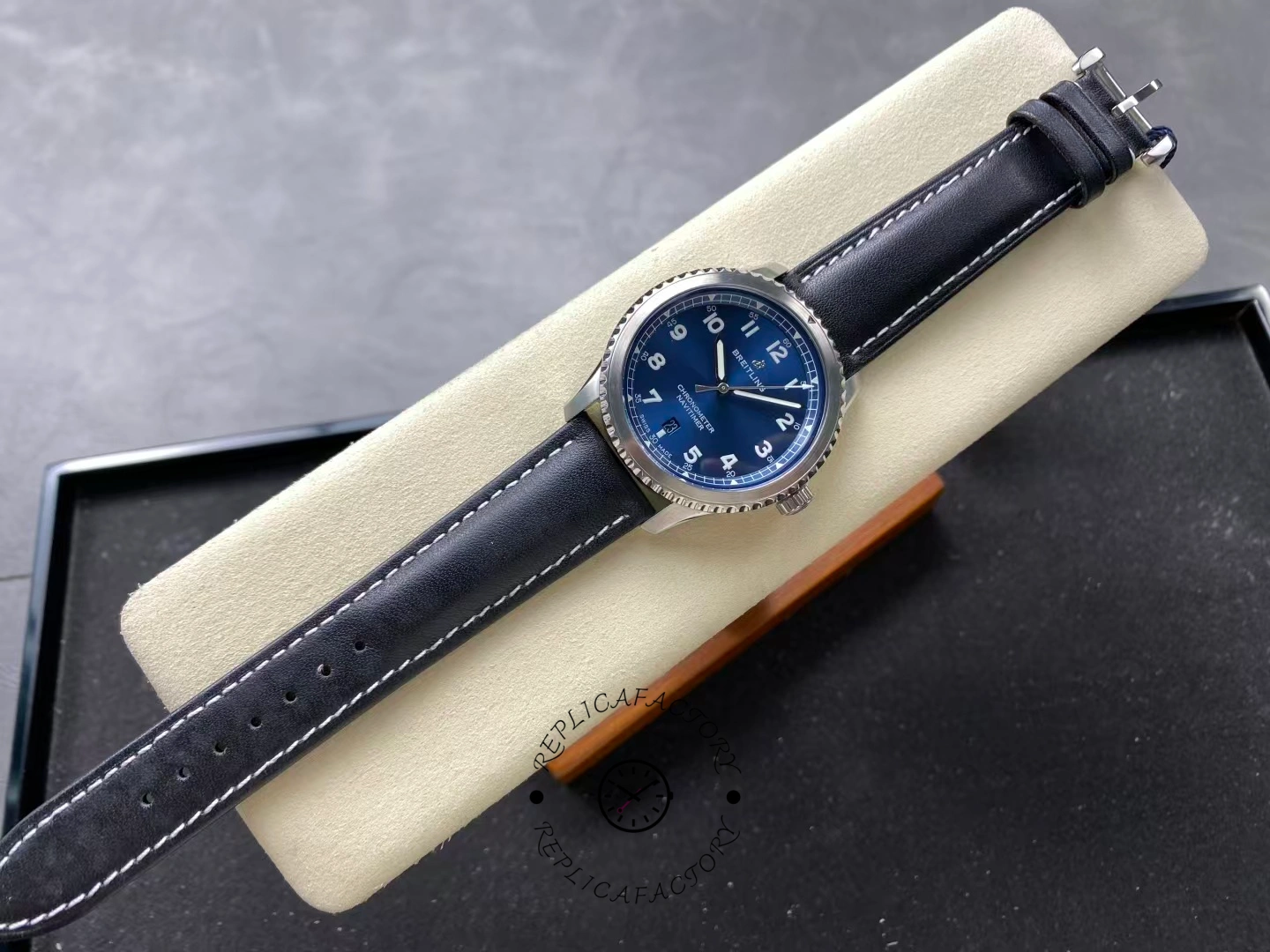 Full top-down view of Breitling Navitimer 8 Automatic 41 A17314101C1X2 on display cushion.
