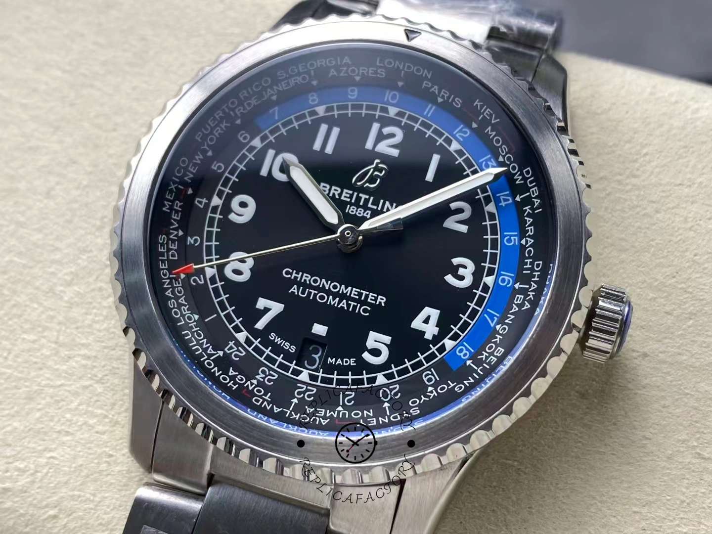 Close-up of Breitling Aviator 8 B35 AB3521U41B1A1 showing world time black dial with blue 24-hour ring.
