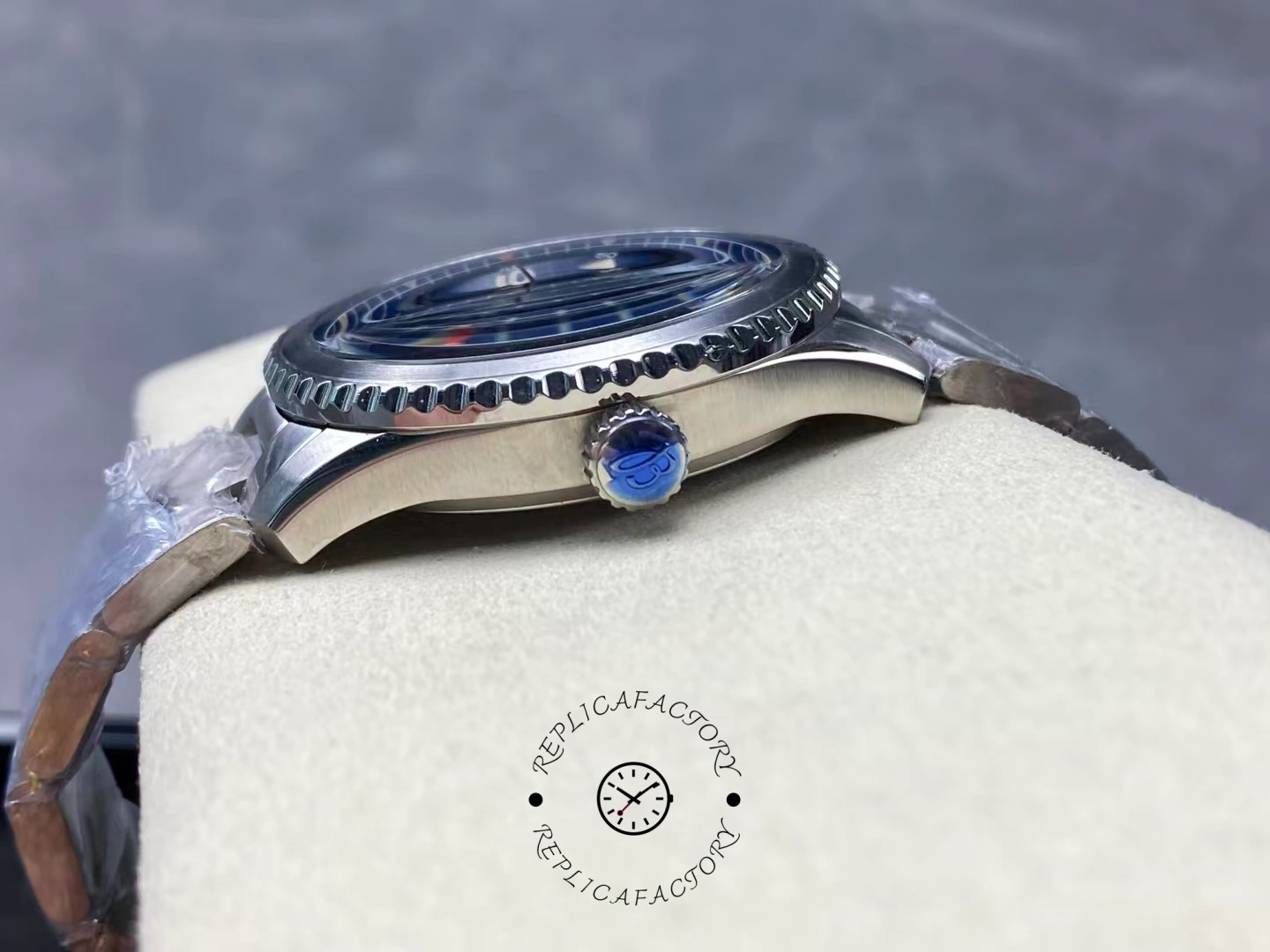 Crown side of Breitling Aviator 8 A17315101C1A1 showing blue logo crown and polished case.