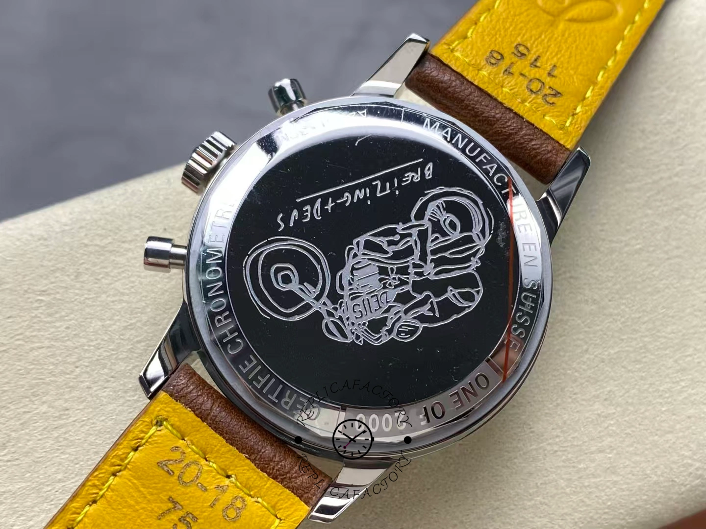 Caseback of Breitling Top Time Deus A233112A1A1X1 engraved with rider design.
