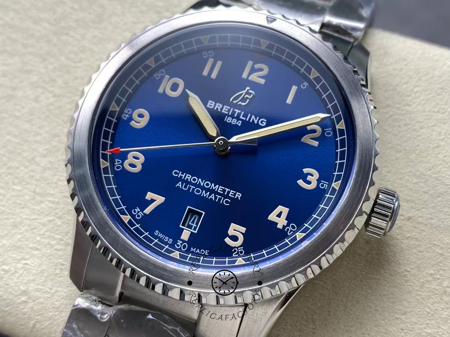 Close-up of Breitling Aviator 8 Automatic 41 A17315101C1A1 showing blue dial with yellow Arabic numerals.