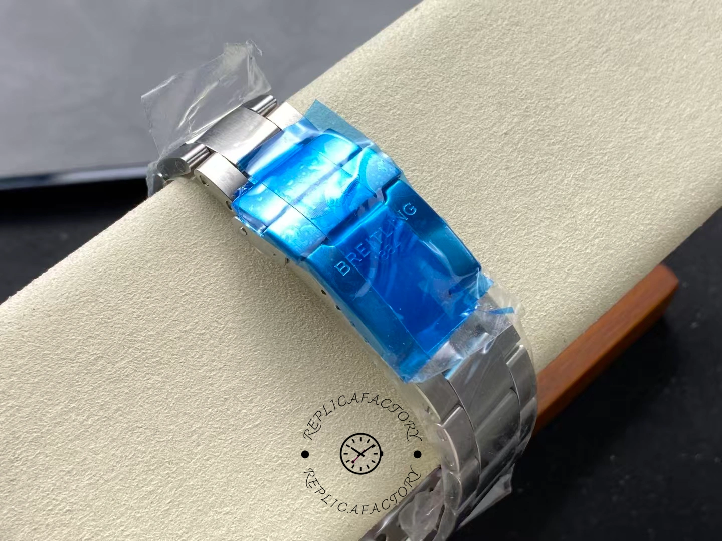 Bracelet clasp of Breitling Avenger Chronograph 45 A13317101B1A1 with blue protective film.