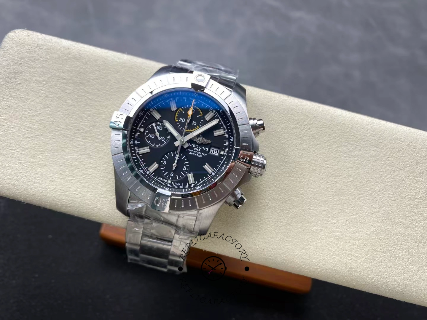 Full view of Breitling Avenger Chronograph 45 A13317101B1A1 on display stand.