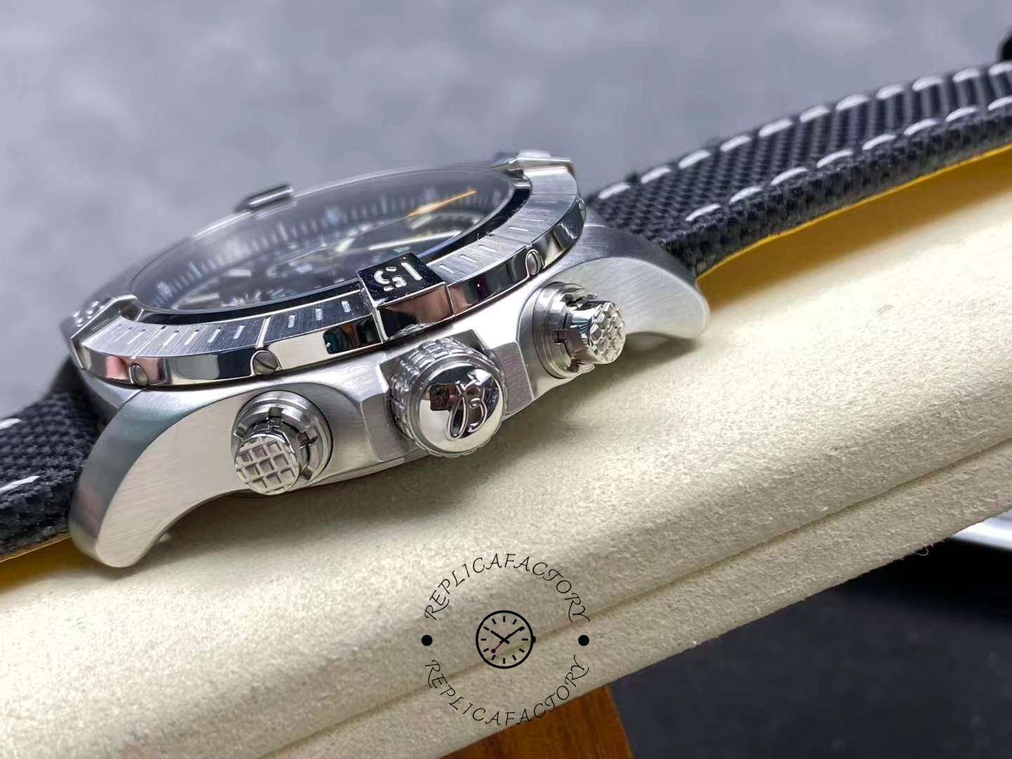 Side view of Breitling Avenger Chronograph 45 A13317101B1X1 showing crown and pushers.