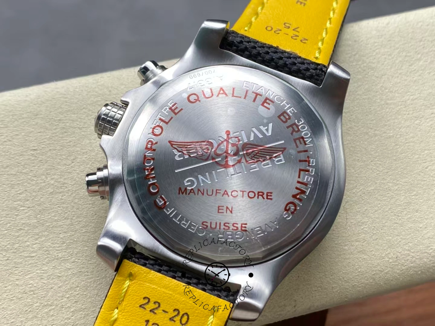 Caseback of Breitling Avenger Chronograph 45 A13317101B1X1 engraved with red quality marks.