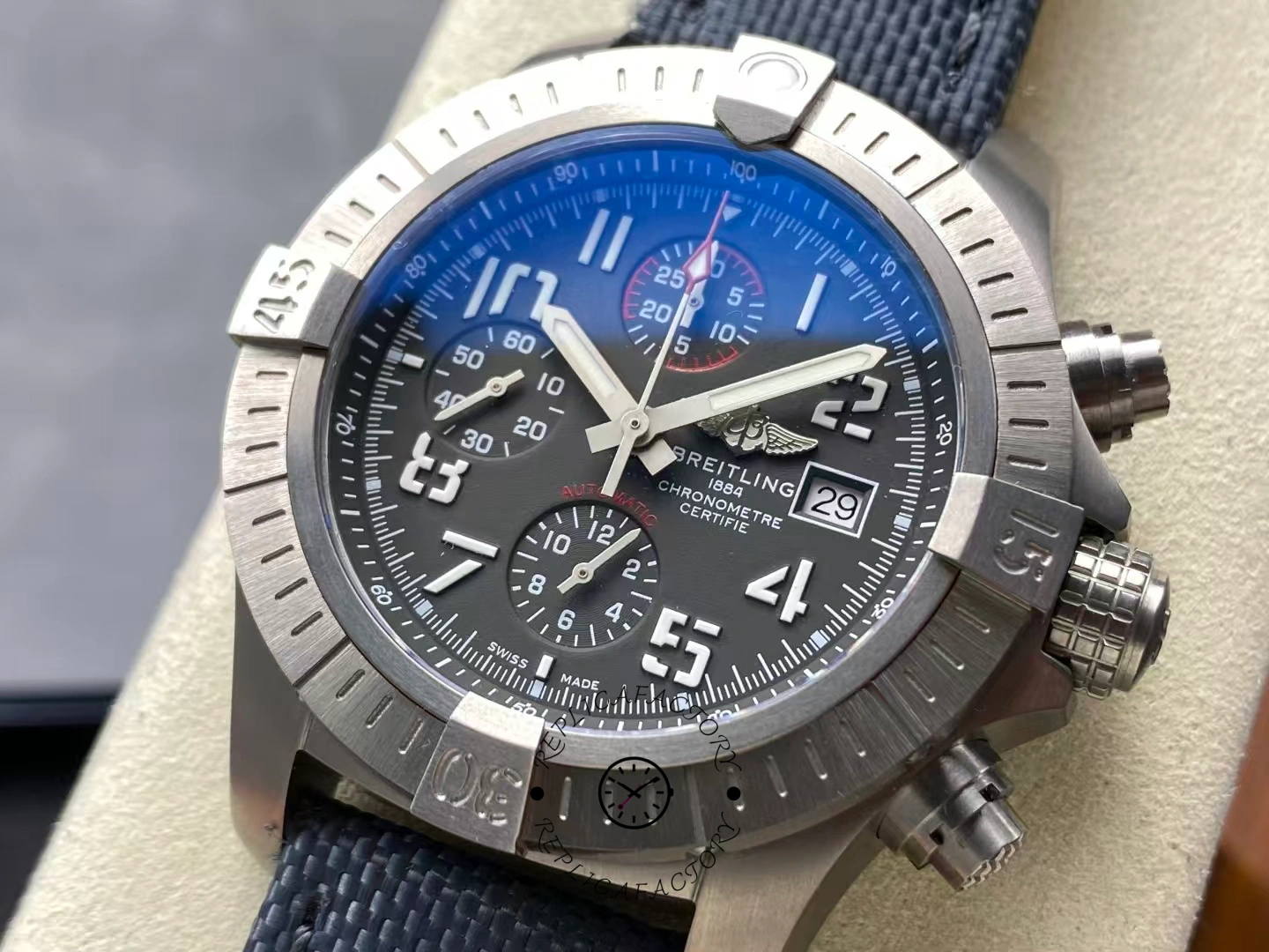 Close-up of Breitling Avenger Bandit E13383101M1W1 chronograph dial with luminous hands.