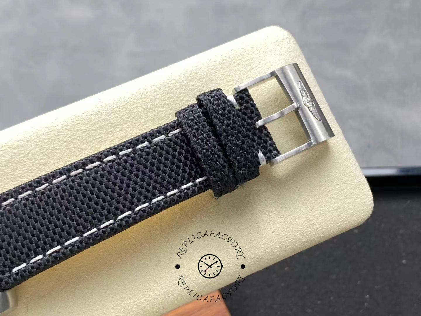 Buckle detail of Breitling Avenger Chronograph 45 A13317101B1X1 with engraved logo.