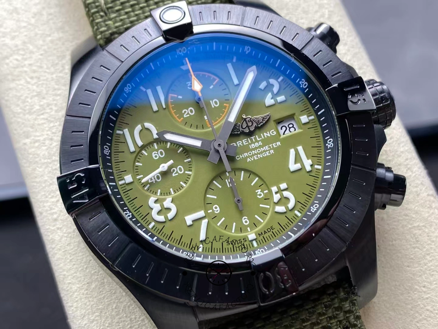 Macro view of Breitling Avenger Chronograph 45MM V13317101L1X1 green dial with subdials.