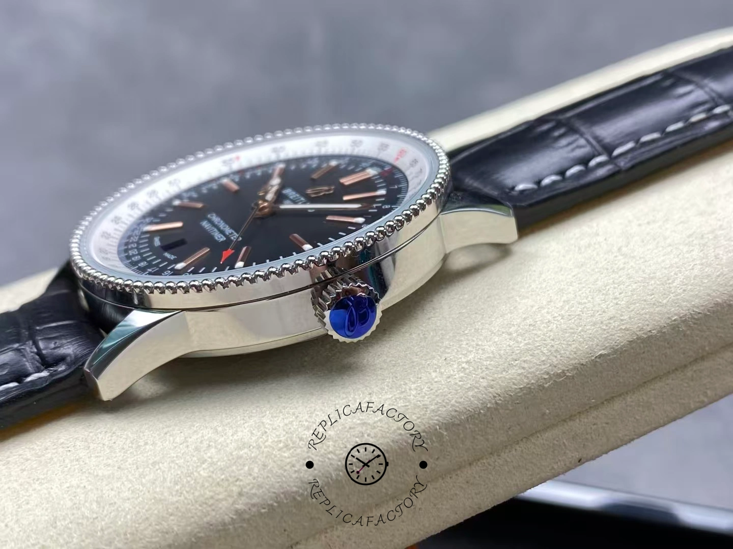 Side view of Breitling Navitimer 41mm A17326211B1P1 showing signed blue crown.