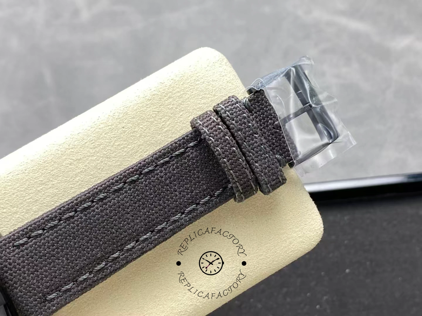 Fabric strap close-up of Breitling Avenger Blackbird 44 V17311101B1W1 with black buckle.