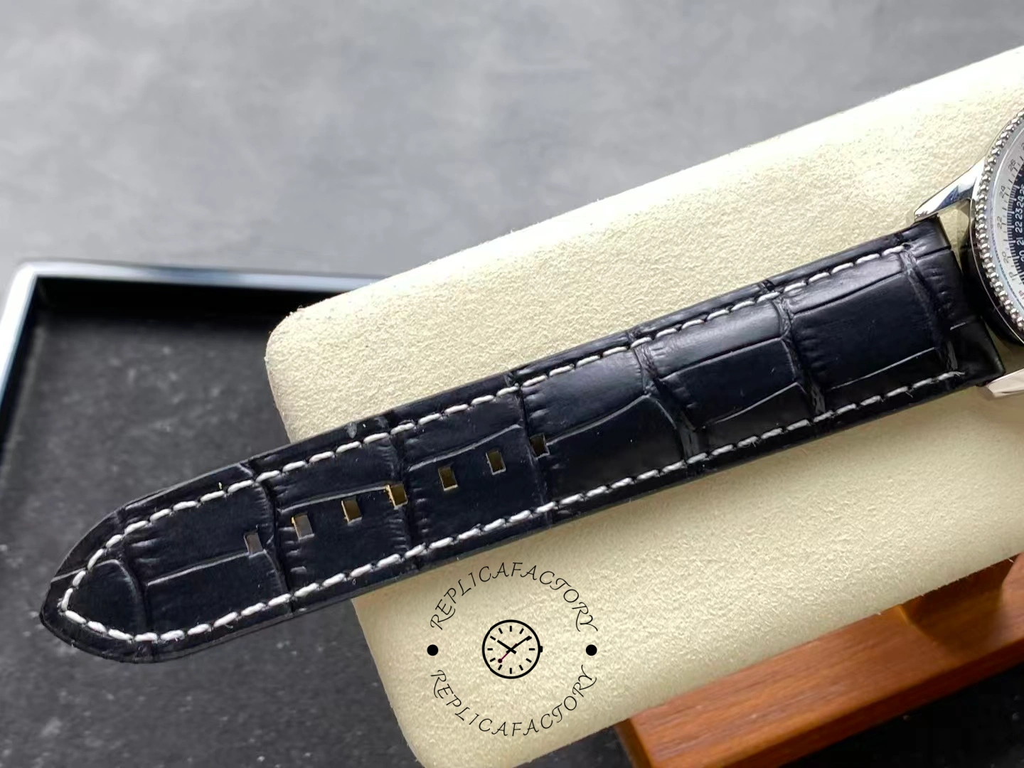 Black alligator strap of Breitling Navitimer 41mm A17326211B1P1 showing stitching details.