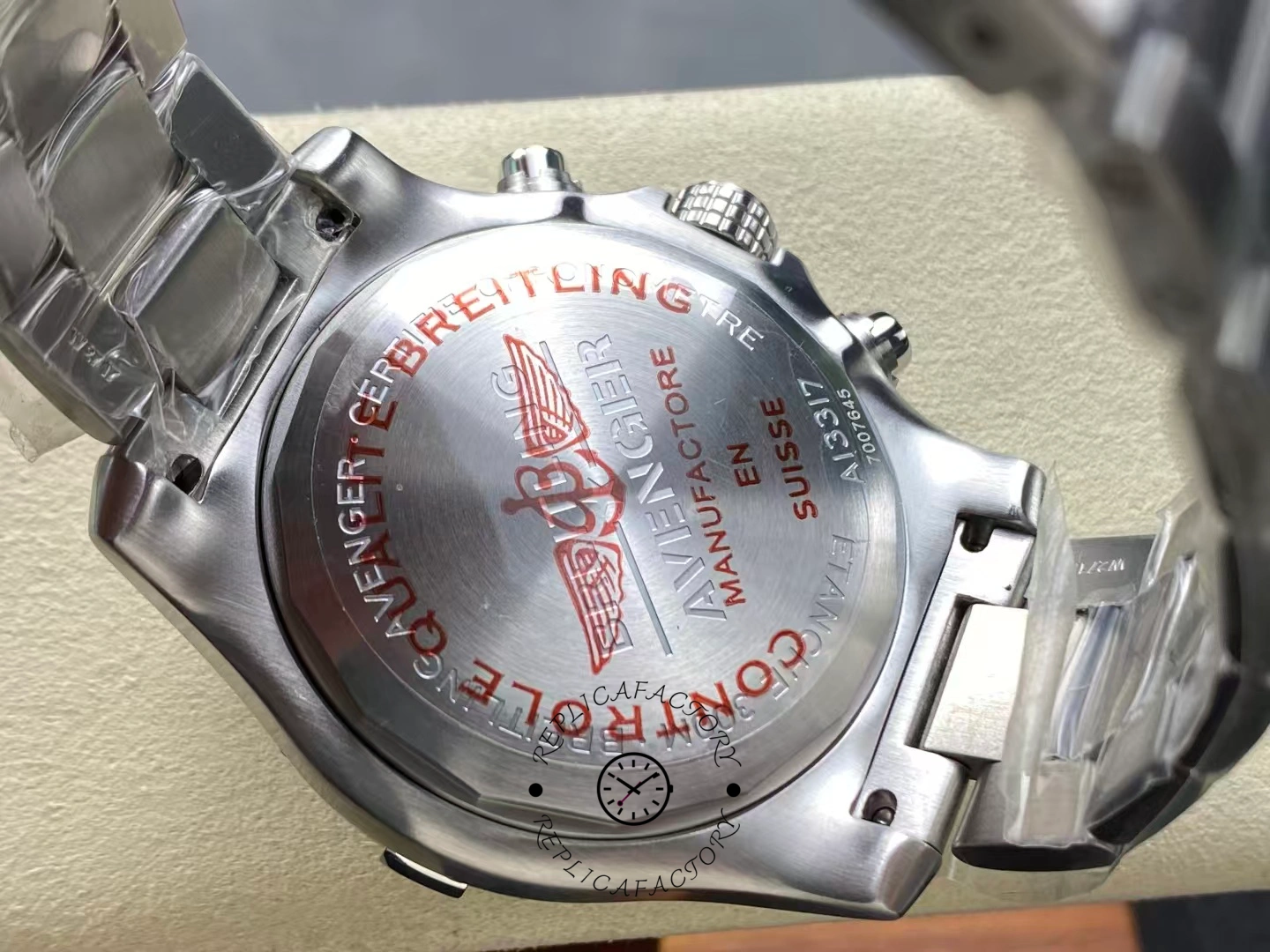 Caseback of Breitling Avenger Chronograph 45 A13317101C1A1 engraved with red certification text.
