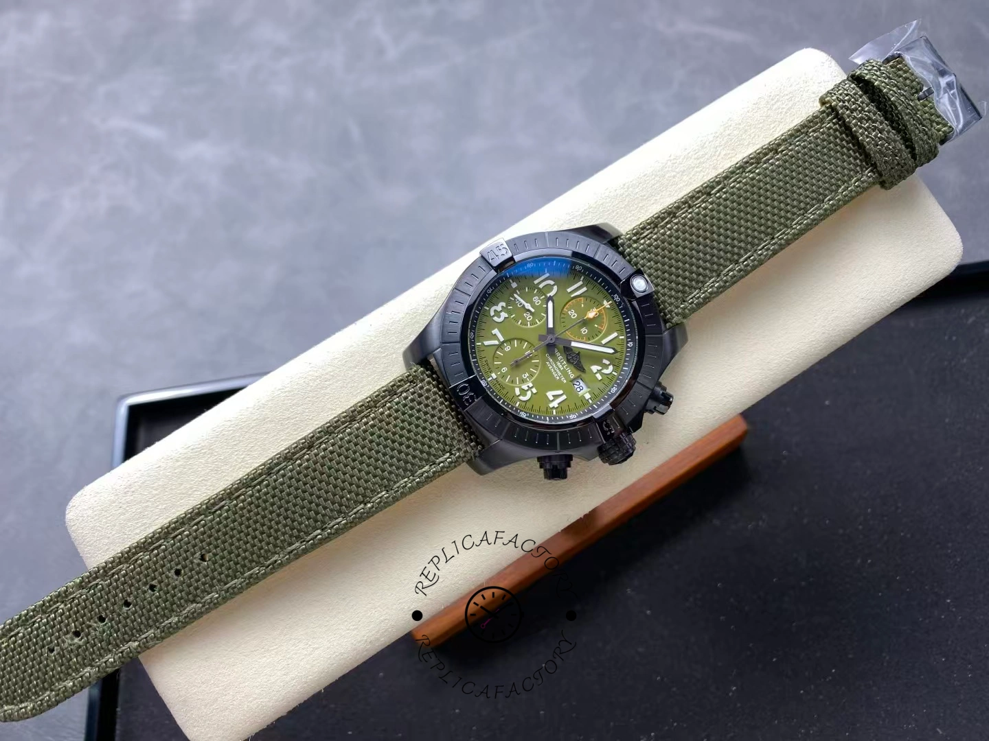 Full view of Breitling Avenger Chronograph 45MM V13317101L1X1 showing green dial and strap.