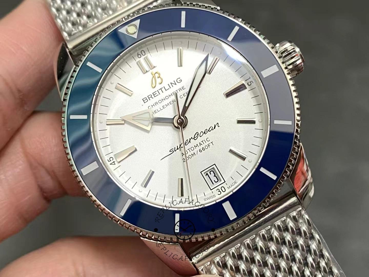 Close-up of Breitling Superocean Heritage II B20 AB201016G827-154A with silver dial and blue bezel.