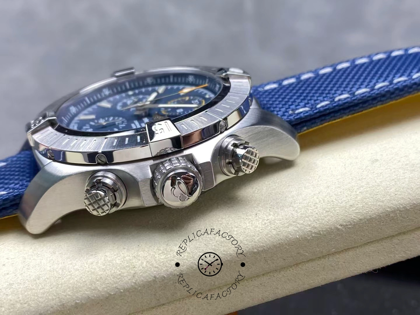 Side view of Breitling Avenger Chronograph 45 A13317101C1X1 showing crown and pushers.