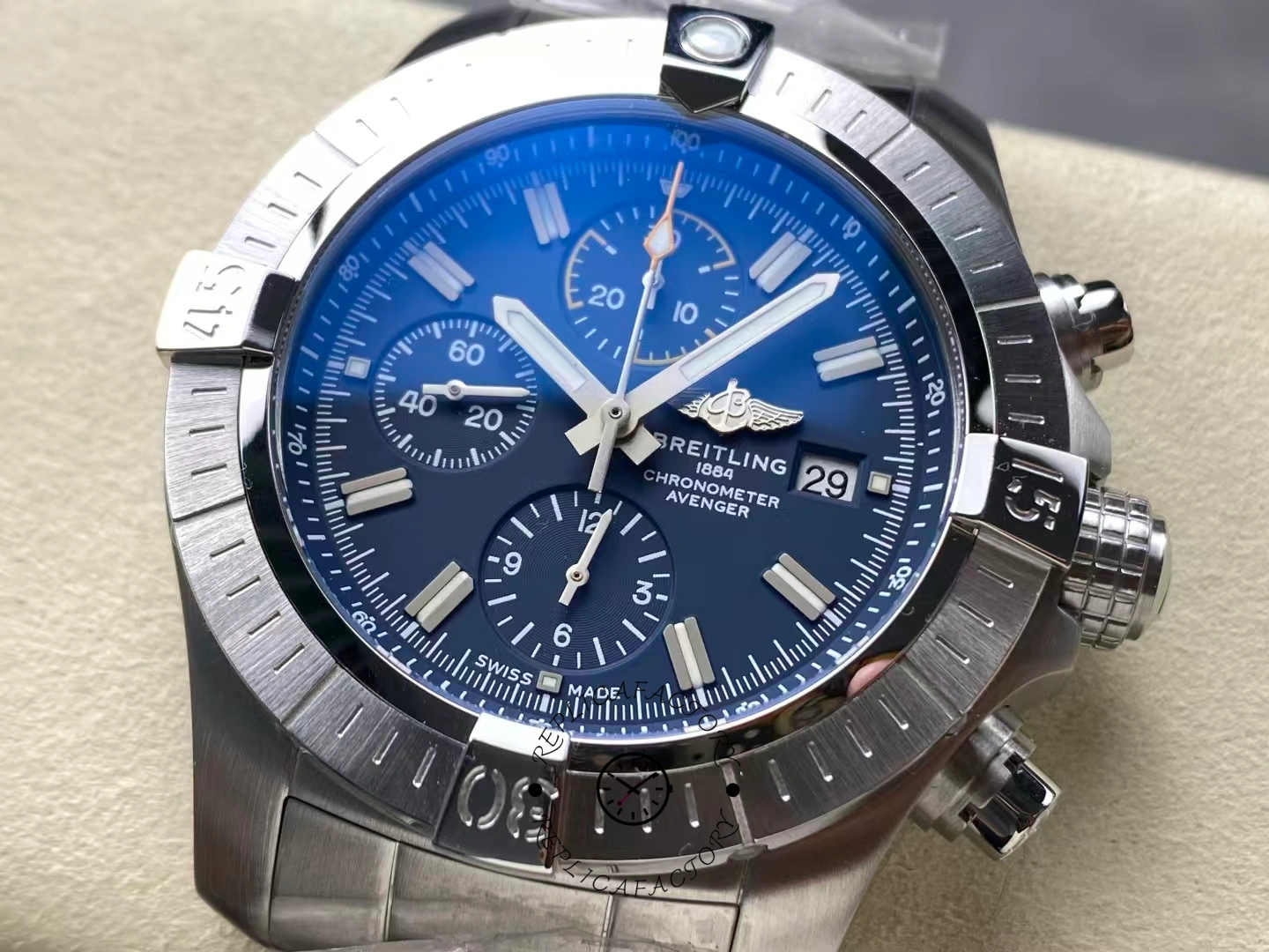 Close-up of Breitling Avenger Chronograph 45 A13317101C1A1 dial with luminous hour markers.