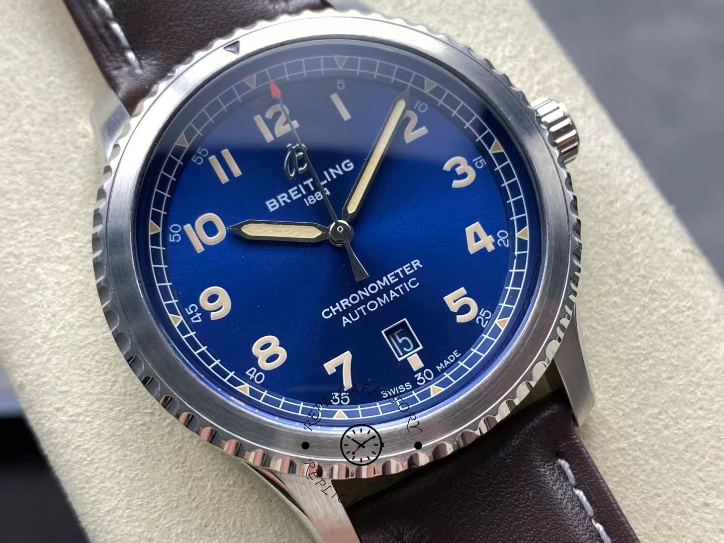 Close-up of Breitling Aviator 8 Automatic 41 A17315101C1X1 with blue dial and beige numerals.