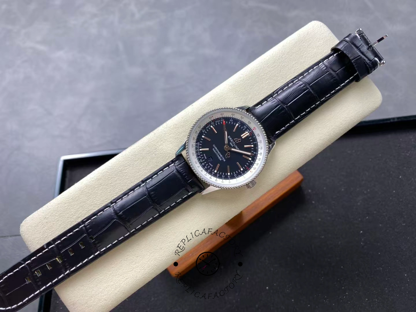 Full view of Breitling Navitimer 41mm A17326211B1P1 with black dial and leather strap.